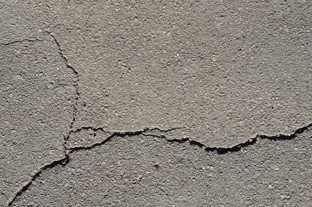 Cracks in need of repairs in cement